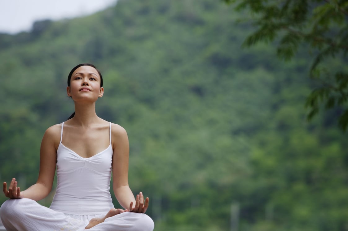 Woman Meditating Outdoors